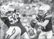  ?? Brett Carlsen Getty Images ?? CHARGERS CENTER Mike Pouncey (53) says “we have to be ready to protect Philip [Rivers],” right.