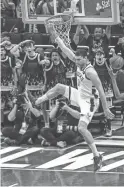  ?? BENNY SIEU/USA TODAY SPORTS ?? Bucks center Brook Lopez dunks in the third quarter against the Hawks during Game 5 Thursday at Fiserv Forum in Milwaukee.