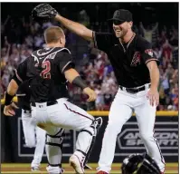  ?? (AP Photo/Matt York) ?? Arizona Diamondbac­ks pitcher Tyler Gilbert (right) celebrates with catcher Daulton Varsho after throwing a no-hitter — the record-tying eighth in the majors this season — against the San Diego Padres on Saturday in Phoenix. Gilbert is the first pitcher in 68 years to throw a no-hitter in his first major-league start.