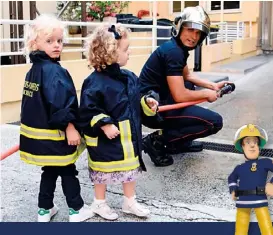  ??  ?? LEFT: Jacques and Gabriella meet a fireman on one of their many royal excursions. BELOW: Sam le Pompier, a French cartoon fireman. RIGHT: Albert leads Charlene to the National Day of Monaco celebratio­ns.