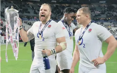  ?? REUTERS ?? SWEET SUCCESS: James Haskell, left, and Dylan Hartley, right, celebrate England’s first grand slam in 13 years.