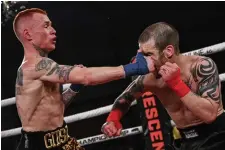  ?? PHIL LAMBERT THE CANADIAN PRESS FILE PHOTO ?? Canadian flyweight Devin (The Canadian Assassin) Gibson, left, battles Kody Murray last March at BKFC Fight Night: New York 2 at the Seneca Allegany Resort & Casino Event Center.