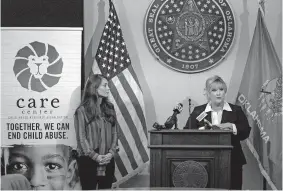  ?? THE OKLAHOMAN] ?? First Lady Sarah Stitt, left, and The CARE Center CEO Stacy McNeiland speak Wednesday during a news conference at the state Capitol to announce the initiative “Sarah's Challenge” to provide services and support to child abuse victims. [CHRIS LANDSBERGE­R/