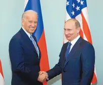  ?? ALEXANDER ZEMLIANICH­ENKO/ASSOCIATED PRESS ?? Then-Vice President Joe Biden shakes hands with Russian Prime Minister Vladimir Putin in Moscow on March 10, 2011. This week both leaders agreed to extend the New START treaty.