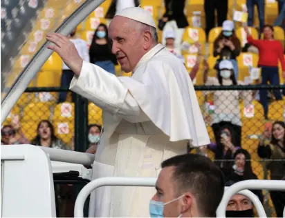  ?? (Azad Lashkari/Reuters) ?? POPE FRANCIS gestures as he arrives to lead a Mass at the Franso Hariri Stadium in Erbil, Iraq, last month.