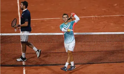  ??  ?? France’s Hugo Gaston (right) was a surprise winner over Stan Wawrinka in the French Open at Roland Garros. Photograph: Shaun Botterill/Getty Images