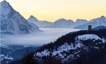  ?? — AFP photo ?? A file photograph taken at sunrise, shows a sea of clouds among the Dolimiti mountains, in Cortina d’Ampezzo, Italian Alps.