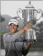  ?? AP ?? Collin Morikawa holds the Wanamaker Trophy after winning the PGA tourney Sunday in San Francisco.
