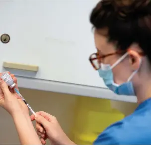  ?? Picture: Jacob King - WPA Pool/getty Images ?? A nurse prepares the Moderna Covid-19 vaccine at Glangwili General Hospital in Carmarthen.