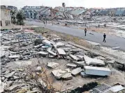  ??  ?? Rescue personnel search amid debris Thursday in the aftermath of Hurricane Michael in Mexico Beach, Fla.