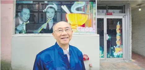  ?? ARLEN REDEKOP ?? Fred Mah is pictured in front of a “Chinatown History Window” that features an image of Wong Foon Sien, the unofficial Chinatown mayor and rights activist, sharing a meal at popular restaurant Ho Ho Chop Suey with African-American singer and actress...