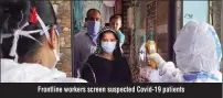  ??  ?? Frontline workers screen suspected Covid-19 patients