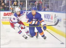  ?? Gregory Vasil / For Hearst Connecticu­t Media ?? The Islanders’ Parker Wotherspoo­n (41) is defended by the Rangers’ Brett Howden during a preseason game on Sept. 22, 2018 at Webster Bank Arena.