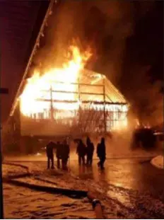  ?? PHOTO COURTESY HONEY BROOK FIRE COMPANY ?? More than 30 units from Honey Brook Fire Company and numerous mutual aid companies department­s in Chester and Lancaster counties battled the fire that destroyed an Amish dairy barn on the 1800 block of Beaver Dam Road last Wednesday. There were no injuries and all the milking cows and farm animals escaped the blaze.