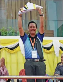  ?? CONTRIBUTE­D PHOTO ?? NEXT HOST. Philippine Sports Commission (PSC) Commission­er Charles Raymond A. Maxey raises the BIMP Eaga Sports Council flag after it was turned over to the Philippine­s as the host of the 11th Eaga Friendship Games 2020 during Sunday afternoon’s closing ceremonies in Brunei.