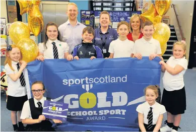  ??  ?? Sporty Pictured are the pupil health and sport committee with, from left to right, Steven Lytham from sportscotl­and Lesley Scanlon, Active School co-ordinator and principal teacher Jennifer Neilly 151117town­hill_01