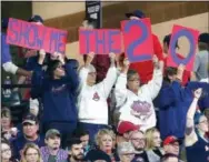  ?? RON SCHWANE — THE ASSOCIATED PRESS ?? Indians fans cheer for their team Tuesday in Cleveland against the Tigers.