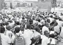  ?? ROSEMARY O’HARA/COURTESY PHOTOS ?? At a school near Dar es Salaam, Tanzania, this teacher holds class in a courtyard — before about 700 students. Below, Haji Ngatumbura, whose daughter is a Morogoro elementary school student, made a big impression on Editorial Page Editor Rosemary O’Hara.