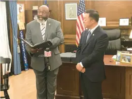  ?? COURTESY ?? Carleton J. Giles, left, of Milford, the ousted chairman of the Board of Pardons and Paroles, stands with state Attorney General William Tong.