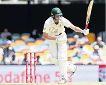  ?? PHOTO: GETTY IMAGES ?? Hiding the pain . . . Australia’s Cameron Green is struck by the ball during day four of the deciding fourth test against India at the Gabba in Brisbane yesterday.