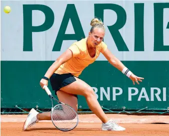  ?? AFP ?? Richel Hogenkamp of The Netherland­s returns to Jelena Jankovic of Serbia in their French Open first round match at Roland Garros in Paris on Monday. Hogenkamp won in straight sets 6-2, 7-5.
