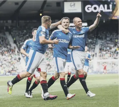  ??  ?? Andy Halliday, centre, celebrates his impressive goal which put Rangers 2-1 up in the 2016 Scottish Cup final. Hibs scored twice late in the game to snatch the cup away from the Ibrox side.