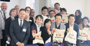  ??  ?? ●●The Japanese delegation, with council officials and health leaders during their visit to Rochdale.