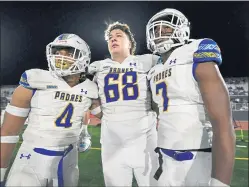  ?? JOSE CARLOS FAJARDO — STAFF PHOTOGRAPH­ER ?? Serra’s Petelo Gi (4), Ryan Silver (68) and quarterbac­k Dominique Lampkin (7) stop to watch Mater Dei celebrate on the field before heading back to the locker room after their CIF Open Division football state championsh­ip game at Saddleback College in Mission Viejo on Dec. 11. Materi Dei defeated Serra 44-7.