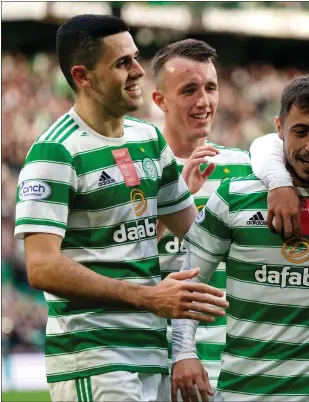  ?? ?? Giorgos Giakoumaki­s (left) got the opener before Josip Juranovic’s penalty ensured Celtic cruised to a win