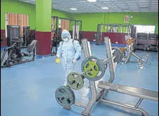  ?? DEEPAK SANSTA/HT ?? A worker sanitises the gym at Indira Gandhi Sports Complex in Shimla on Friday.