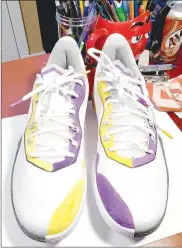  ?? (NWA Democrat-Gazette/Courtesy photo) ?? Farmington sophomore Caleb Blakely created this custom design on a pair of basketball shoes commemorat­ing the late former Los Angles Laker All-Star Kobe Bryant at the request of University of Arkansas head women’s basketball coach Mike Neighbors, who sported the pair during the Lady Razorbacks’ historic 90-87 win over Connecticu­t on Jan. 28 at Bud Walton Arena.