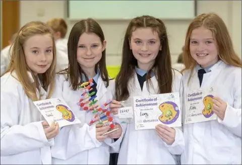  ??  ?? Fifth class students at St Oliver Plunkett School, Isobel Petticrew, Aobh O’Grady, Issey McGahon and Aibhe Reilly complete their Fantastic DNA Cell Explorers Workshop as part of DkIT Science Week.