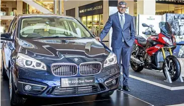  ??  ?? sashi pictured with the BMW 2 series gran Tourer and s 1000 XR, which is on display at Time Kulture 2015. -BMW Malaysia