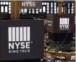  ?? RICHARD DREW — THE ASSOCIATED PRESS FILE ?? Screens above trading posts on the floor of the New York Stock Exchange show the NSE logo.