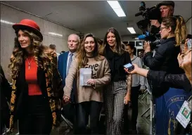  ?? GABRIELA BHASKAR — THE NEW YORK TIMES ?? Jessica Mann, third from left, leaves court in New York on Wednesday after Harvey Weinstein was sentenced to 23years in prison after his conviction on felony sex crimes.