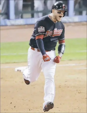  ?? Charlie Riedel/Associated Press ?? Cleveland’s Roberto Perez reacts after hitting his second home run of Game 1 Tuesday — a three-run homer in the eighth inning that extended the Indians lead to 6-0.