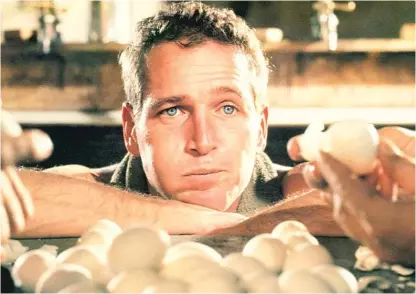  ??  ?? At first willing to eat 50 eggs on a bet, Luke ( Paul Newman) loses interest in entertaini­ng people in “Cool Hand Luke.” | WARNER BROS.