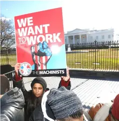  ??  ?? US federal government workers and other demonstrat­ors protest outside the White House during a ‘Rally to End the Shutdown’ in Washington, US. With about a quarter of the federal workforce affected, the shutdown is currently squeezing an estimated US$1.2 billion a week out of the economy and that figure could grow if it drags on. — Reuters photo