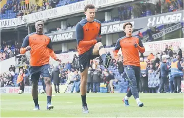  ??  ?? (From left) Tottenham’s Victor Wanyama, Dele Alli and Son Heung-min warm up before the game. — Reuters photo