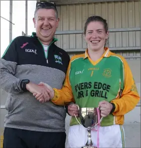  ??  ?? Nicole Fortune of HWH-Bunclody receiving the trophy from Ian Plunkett (Secretary) after last year’s Junior ‘A’ championsh­ip final.