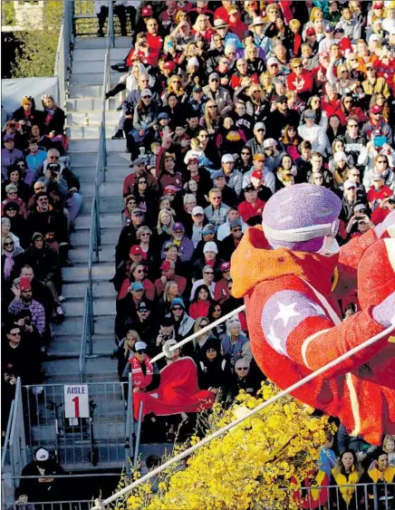  ??  ?? THE 24 HOUR FITNESS f loat, themed “Proud Sponsor of Everyday Athletes,” makes its way along the Rose Parade route Monday