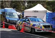  ??  ?? Grim discovery: Police cordon where the body was found. Above: Rental car that was abandoned