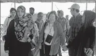  ?? AFP ?? Noble Peace Laureates Mairead Maguire (C) from northern Ireland and Tawakkol Karman (L) from Yemen walk during their visit to Kutupalong refugee camp in Ukhia.