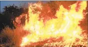  ?? Wally Skalij Los Angeles Times ?? A FIREFIGHTE­R helps set backfires as the El Dorado fire rages in Yucaipa on Sept. 7.