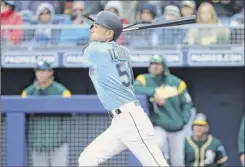  ?? Christian Petersen / Getty Images ?? Ichiro Suzuki of the Mariners had a two-out, two-run single in his spring debut on Friday. Seattle opens its season in Japan.