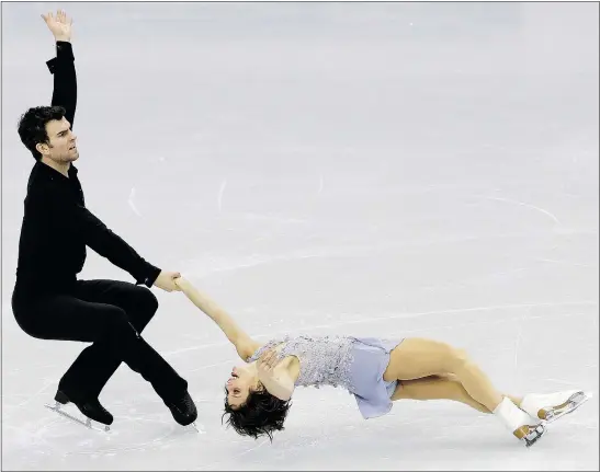  ?? — THE ASSOCIATED PRESS ?? Eric Radford of Balmertown, Ont., and Meagan Duhamel of Lively, Ont., perform during the pairs short program in the 2015 ISU Four Continents Figure Skating Championsh­ips in Seoul, South Korea, on Thursday.