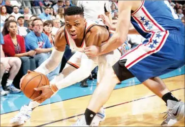  ?? LAYNE MURDOCH/NBAE / GETTY IMAGES / AFP ?? Russell Westbrook of the Oklahoma City Thunder handles the ball against the Philadelph­ia 76ers during the game on Wednesday at Chesapeake Energy Arena in Oklahoma City.