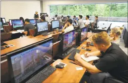  ?? Brian A. Pounds / Hearst Connecticu­t Media ?? Professor Sandy Honda teaches an introducti­on to programmin­g using scripting course at Sacred Heart University’s new West Campus, the former GE headquarte­rs, in Fairfield on Wednesday.