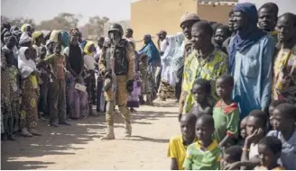  ??  ?? A Burkina Faso soldier patrols at district welcoming Internally Displaced People (IDP) from northern Burkina Faso in Dori [File: AFP]