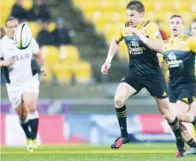  ??  ?? Chip and chase: Hurricanes fly-half Beauden Barrett